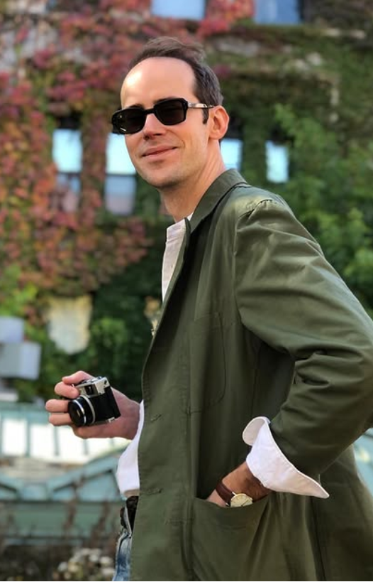Steve Kroodsma holding a camera